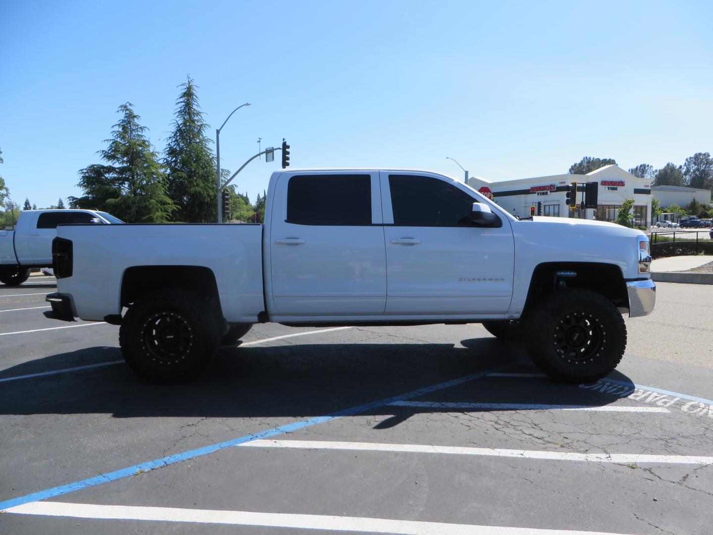 2018 White /BLACK Chevrolet Silverado 1500 LT (3GCPCREC7JG) with an 5.3L V8 OHV 16V engine, automatic transmission, located at 2630 Grass Valley Highway, Auburn, CA, 95603, (530) 508-5100, 38.937893, -121.095482 - Must see Pre Runner.... CST front lift spindals, Camburg UCA's, King Adjustable 2.5 Coil-overs, King 2.5 rear shocks, 35" Toyo RT Trail tires, 17" Method Race wheels, MZ front skid plate, G2 rear differntail cover, Full size bed mounted spare tire, Black Vinyl roof wrap, smoke tail lights and 3rd br - Photo#3